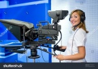 stock-photo-a-female-cameraman-at-a-studio-smiles-into-camera-57509311