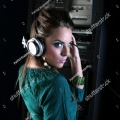 stock-photo-attractive-girl-dj-in-sound-room-with-headphones-3028071