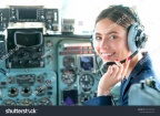 stock-photo-happy-pilot-portrait-of-young-pilot-in-uniform-posing-with-a-happy-toothy-smile-with-aircraft-on-1582032379