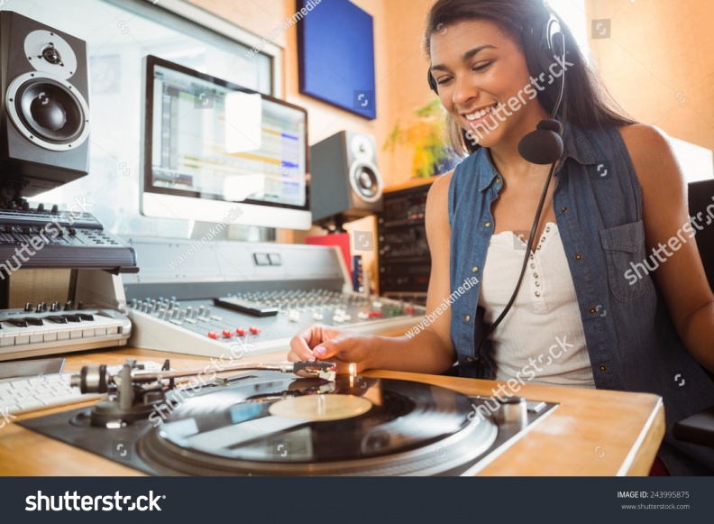 stock-photo-portrait-of-an-university-student-with-a-turn-table-in-the-studio-of-a-radio-243995875.jpg