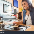 stock-photo-portrait-of-an-university-student-with-a-turn-table-in-the-studio-of-a-radio-243995875