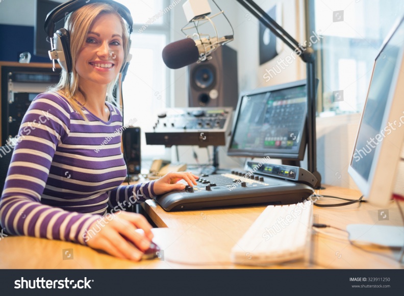 stock-photo-portrait-of-female-radio-host-using-computer-while-broadcasting-in-studio-323911250