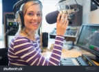 stock-photo-portrait-of-happy-young-female-radio-host-broadcasting-in-studio-324754328