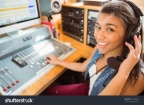 stock-photo-smiling-university-student-mixing-audio-in-the-studio-of-a-radio-243998962