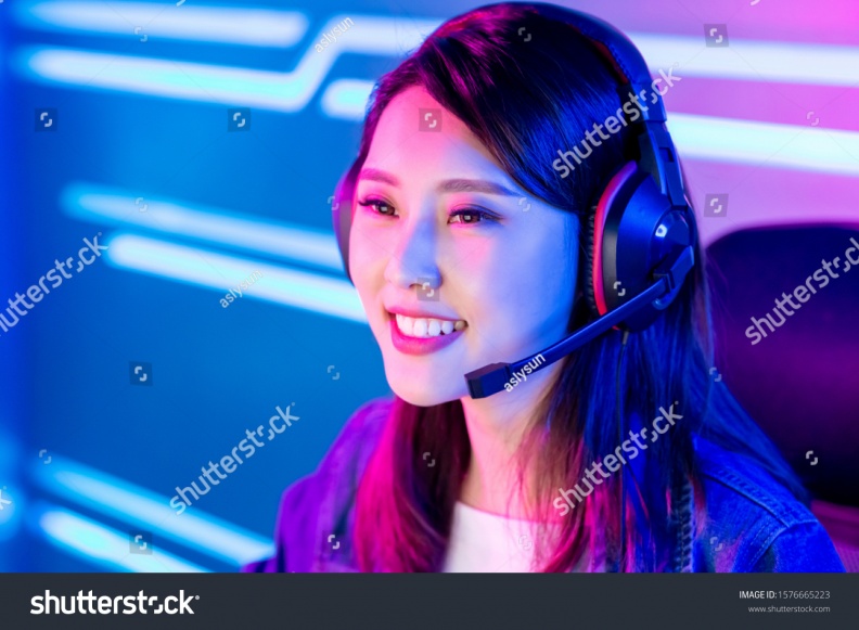stock-photo-young-asian-pretty-pro-gamer-have-live-stream-and-chat-with-fans-happily-1576665223.jpg
