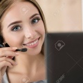 46009159-portrait-of-beautiful-call-center-operator-at-work-woman-with-headset-talking-to-someone-online