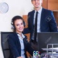 53497258-portrait-of-two-happy-help-line-consultants-at-workplace