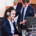 57176674-portrait-of-two-young-help-line-operators-at-workplace