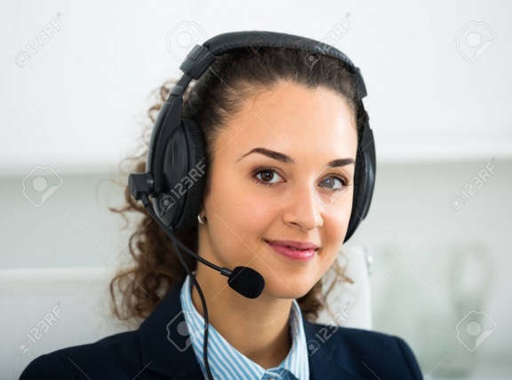 68740286-portrait-of-smiling-young-woman-with-headset-answering-call-in-office