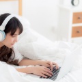 beautiful-young-asia-woman-lying-bedroom-using-laptop 7192-2198