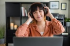 asian-woman-work-with-computer-home-listening-online-class-audio-program-with-headphone 139507-381