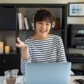 asian-woman-work-with-computer-home-listening-online-class-audio-program-with-headphone 139507-382