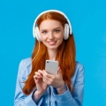 tender-feminine-cute-redhead-woman-wearing-headphones 1258-16608