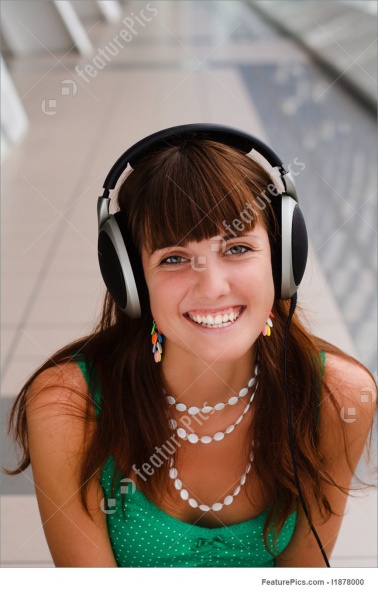 young-smiling-girl-in-headphones-stock-image-878000.jpg