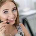 46777352-portrait-of-beautiful-call-center-operator-at-work-woman-with-headset-talking-to-someone-online