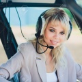 128585818-female-pilot-in-cockpit-of-helicopter-before-take-off-young-woman-helicopter-pilot-