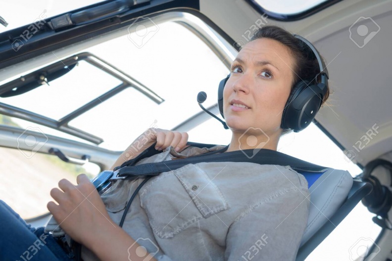 142053186-a-young-woman-helicopter-pilot.jpg