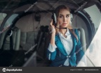 depositphotos 211606522-stock-photo-female-pilot-headphones-poses-helicopter