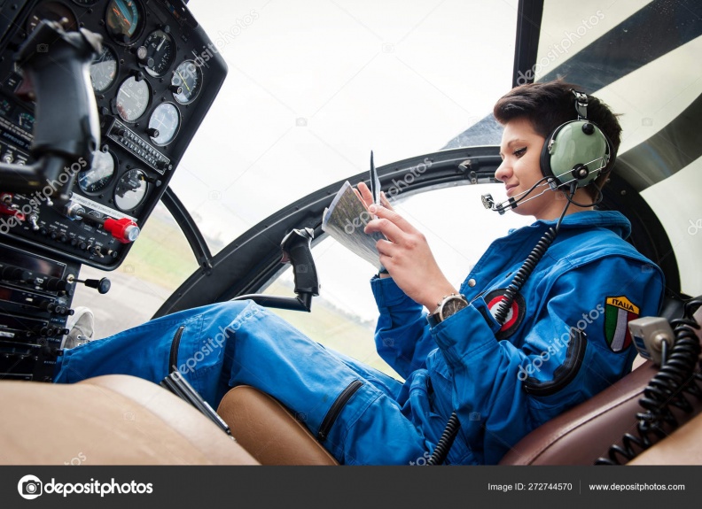 depositphotos_272744570-stock-photo-young-woman-helicopter-pilot-reading.jpg