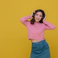 smiling-happy-cheerful-beautiful-asian-woman-wearing-wireless-headphones-enjoying-listening-music 33718-1792