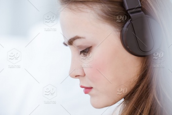 stock-photo-portrait-closeup-beautiful-woman-mood-wearing-seriously-listening-music-attend-wireless-headphone-20bce2fd-9acb-4216-998a-2700c5829165