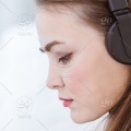 stock-photo-portrait-closeup-beautiful-woman-mood-wearing-seriously-listening-music-attend-wireless-headphone-20bce2fd-9acb-4216-998a-2700c5829165