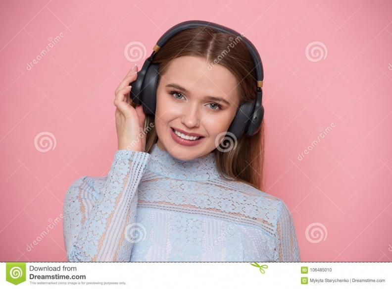 beautiful-happy-young-woman-listen-music-using-mobile-application-isolated-white-106485010.jpg