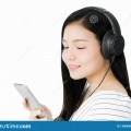 asian-women-listening-to-music-black-headphones-asian-women-listening-to-music-black-headphones-comfortable-130680042
