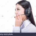 call-center-representative-black-hair-girl-with-headphones-DY16JM