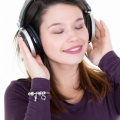fresh-beautiful-young-brunette-woman-with-closed-eyes-with-dj-headphones-posing 100800-745