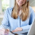depositphotos 310908216-stock-photo-woman-studying-at-home-using