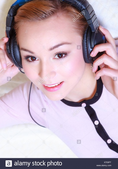 modern-woman-with-headphones-listening-music-X703PT