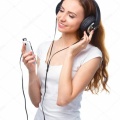 depositphotos 32434141-stock-photo-young-woman-enjoying-music-using