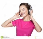 cheerful-young-woman-listening-music-headphones-white-background-68117402