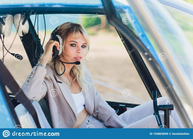 female-pilot-cockpit-helicopter-take-off-young-woman-helicopter-pilot-female-pilot-cockpit-helicopter-154803699.jpg