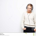 young-beautiful-woman-listening-music-headphones-over-white-background-young-beautiful-woman-listening-music-100769625.jpg