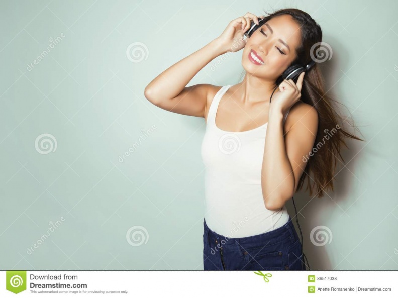 beautiful-young-asian-woman-listening-to-music-headphones-wit-long-hair-enjoying-86517038.jpg