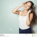beautiful-young-asian-woman-listening-to-music-headphones-wit-long-hair-enjoying-86517038