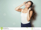 beautiful-young-asian-woman-listening-to-music-headphones-wit-long-hair-enjoying-86517038
