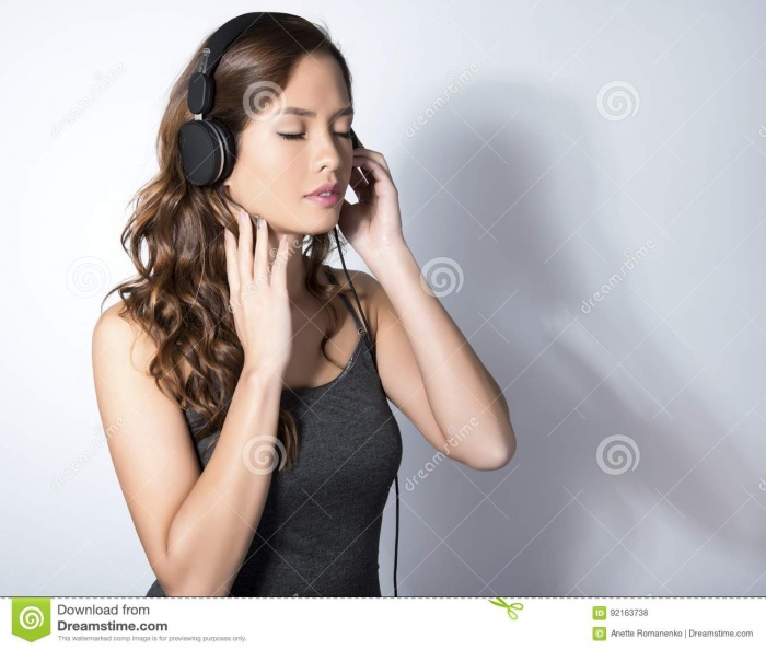 beautiful-young-asian-woman-listening-to-music-headphones-wit-long-hair-enjoying-92163738.jpg