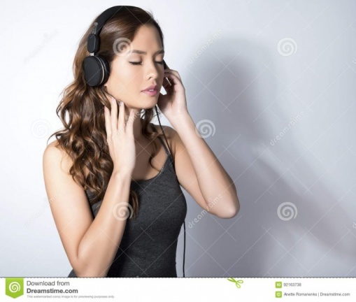 beautiful-young-asian-woman-listening-to-music-headphones-wit-long-hair-enjoying-92163738