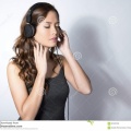 beautiful-young-asian-woman-listening-to-music-headphones-wit-long-hair-enjoying-92163738