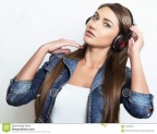 beautiful-young-woman-listening-to-music-headphones-posing-grey-background-beautiful-young-woman-head-phones-104560975