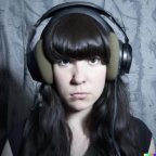A high resolution photo of a young adult woman with black hair and bangs wearing huge black vintage headphones, realistic (5)