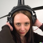 A high resolution photo of an attractive shy young woman wearing a helicopter headset, detailed, realistic (2)