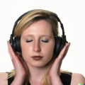 A high resolution, hyperrealistic photograph of a gorgeous young blonde woman with a sleepy look in her eyes, wearing large black vintage headphones, .jpg