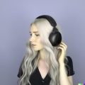 Professional photograph of attractive young blonde woman wearing large black vintage headphones, mastery of color grading and detail, insanely detai (2).jpg