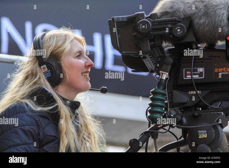 troms-august-17-2014-a-pretty-young-tv-camerawoman-filming-the-news-G7KF53.jpg