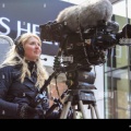 troms-august-17-2014-a-pretty-young-tv-camerawoman-filming-the-news-G7KF54