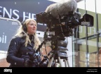 troms-august-17-2014-a-pretty-young-tv-camerawoman-filming-the-news-G7KF54